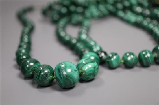 Ten assorted graduated malachite bead necklaces, two with gilt metal spacers, largest approximately 66cm,